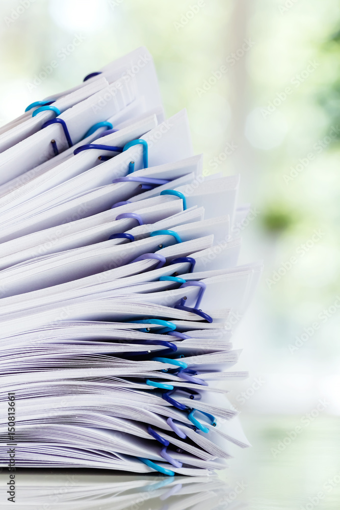 Pile of papers organized with paper clips