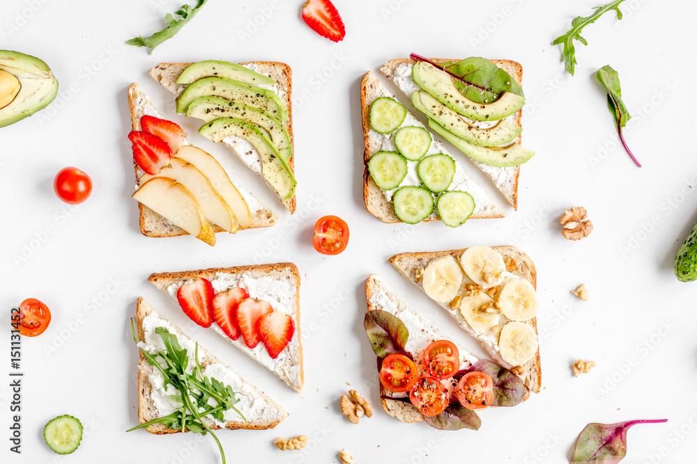 sandwiches set on white table background top view