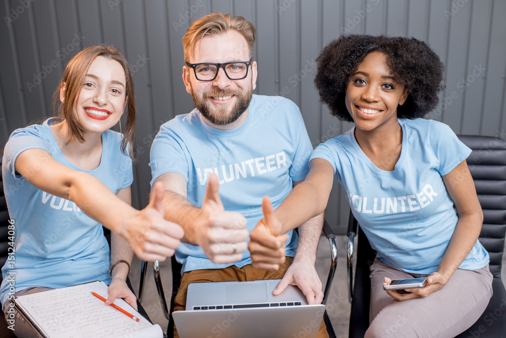 Happy volunteers indoors