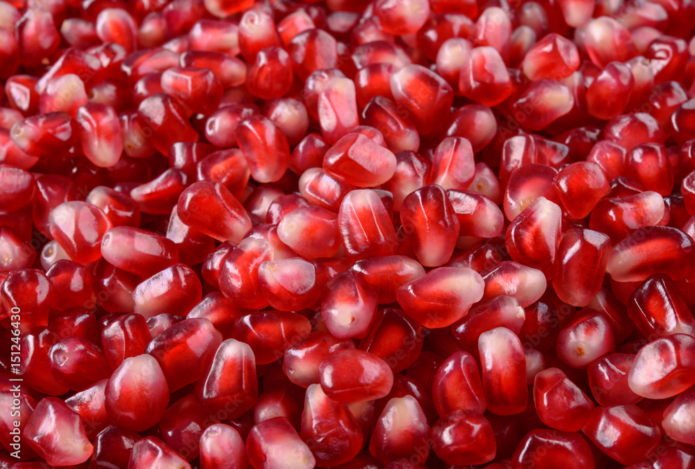 Pomegranate. Fresh raw fruit seeds. Pomegranate background. Macro.