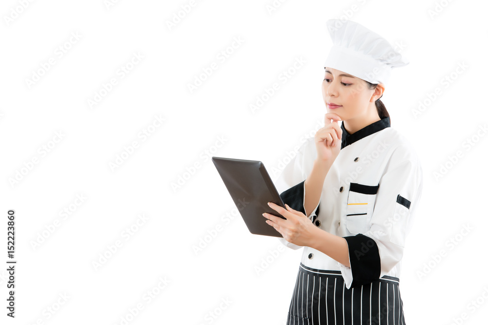 chef looking at digital pad and thinking