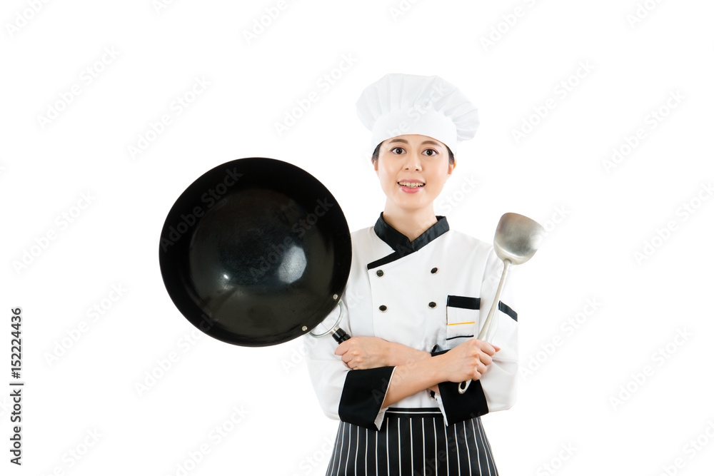 female chef showing wok and spatula tools