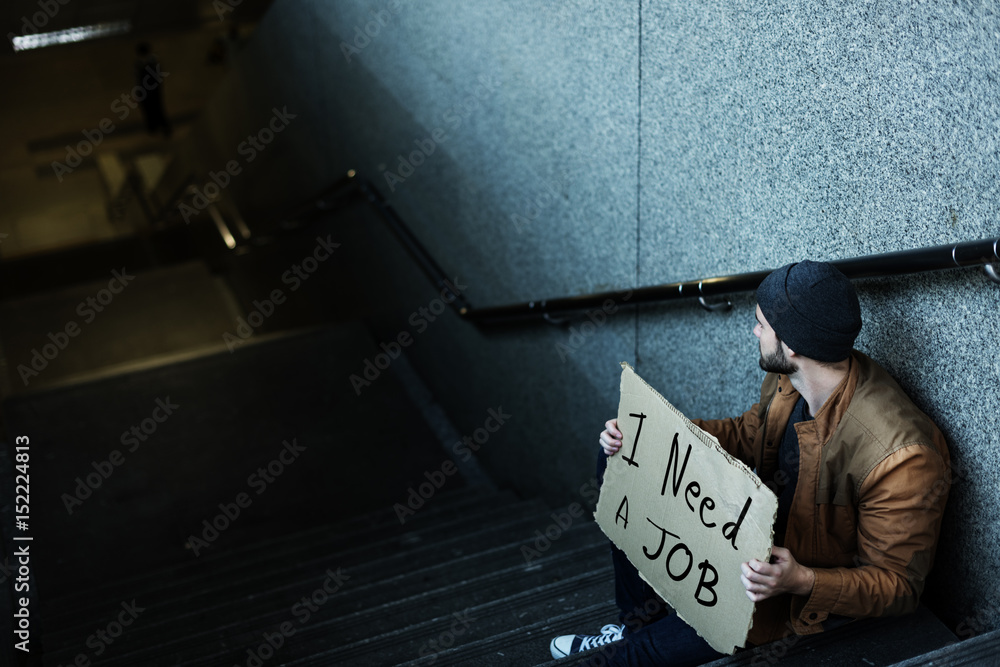 Homeless Man Asking For Job Sitting on Stairway Sidewalk