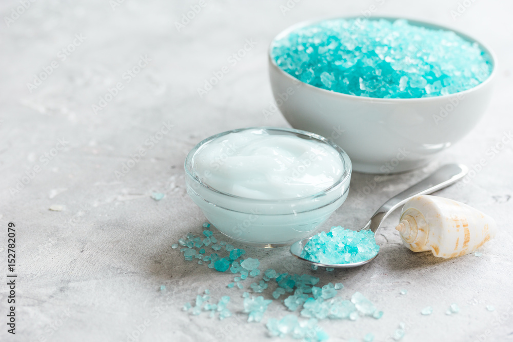 blue spa composition with shells and natural soap on stone desk background