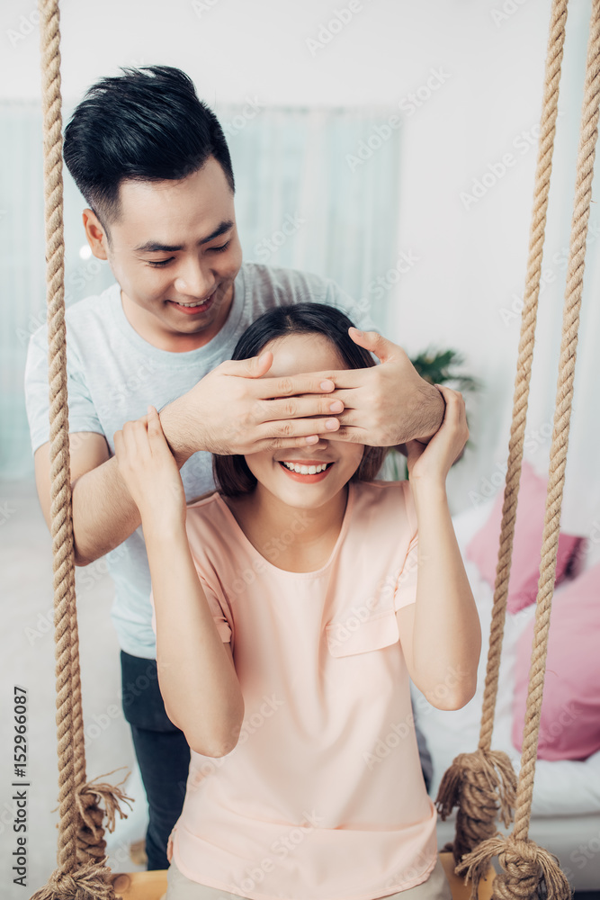 Portrait of young asian couple relaxing at home