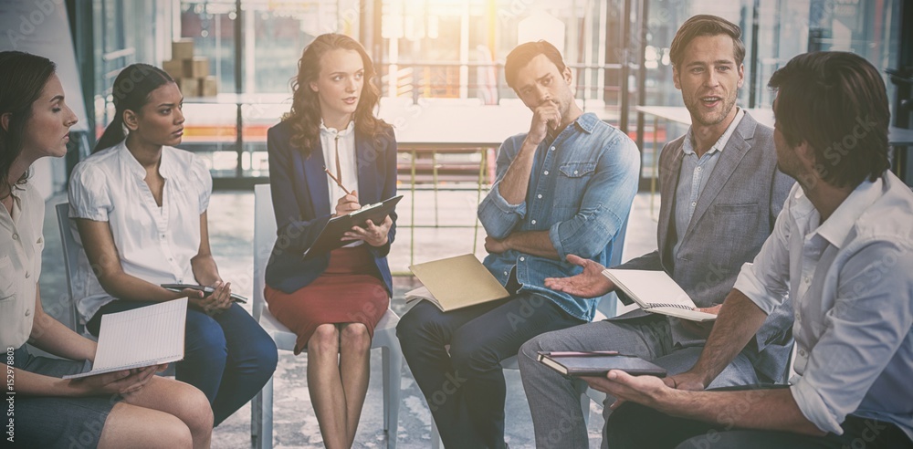 Business executives discussing during meeting