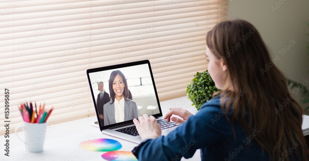 Businesswoman video conferencing in office