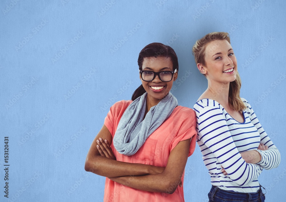 Portrait of women standing arms crossed 