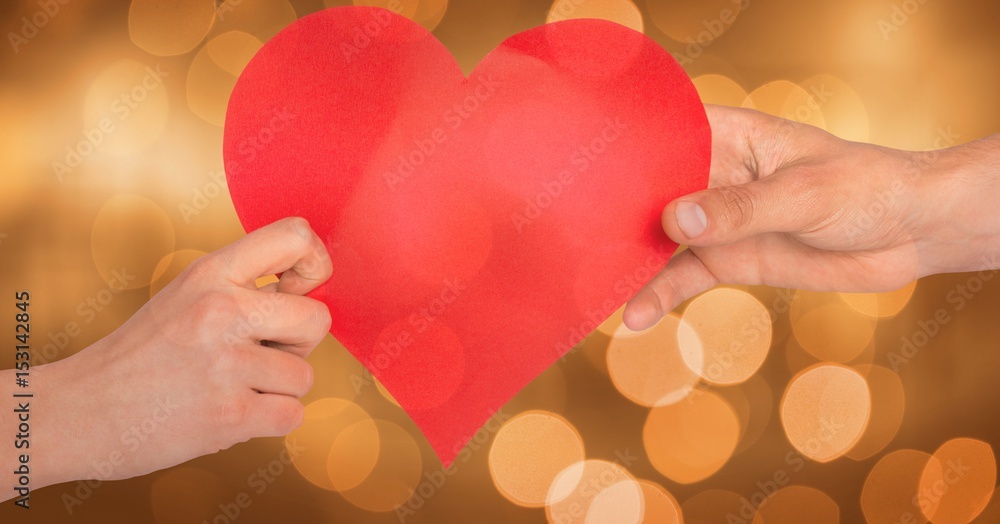 Cropped image of hands holding heart shape 