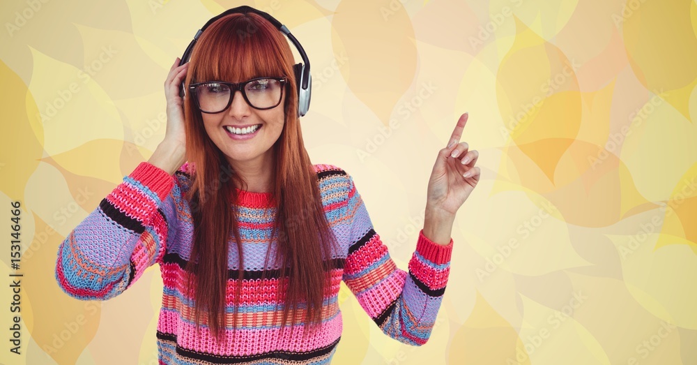 Female hipster listening to music on headphones