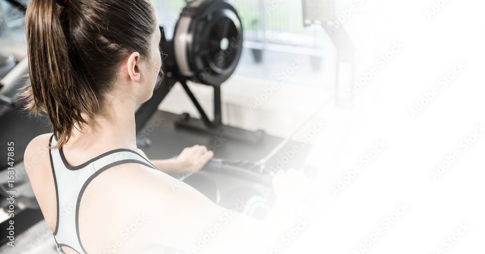 Young woman exercising in gym