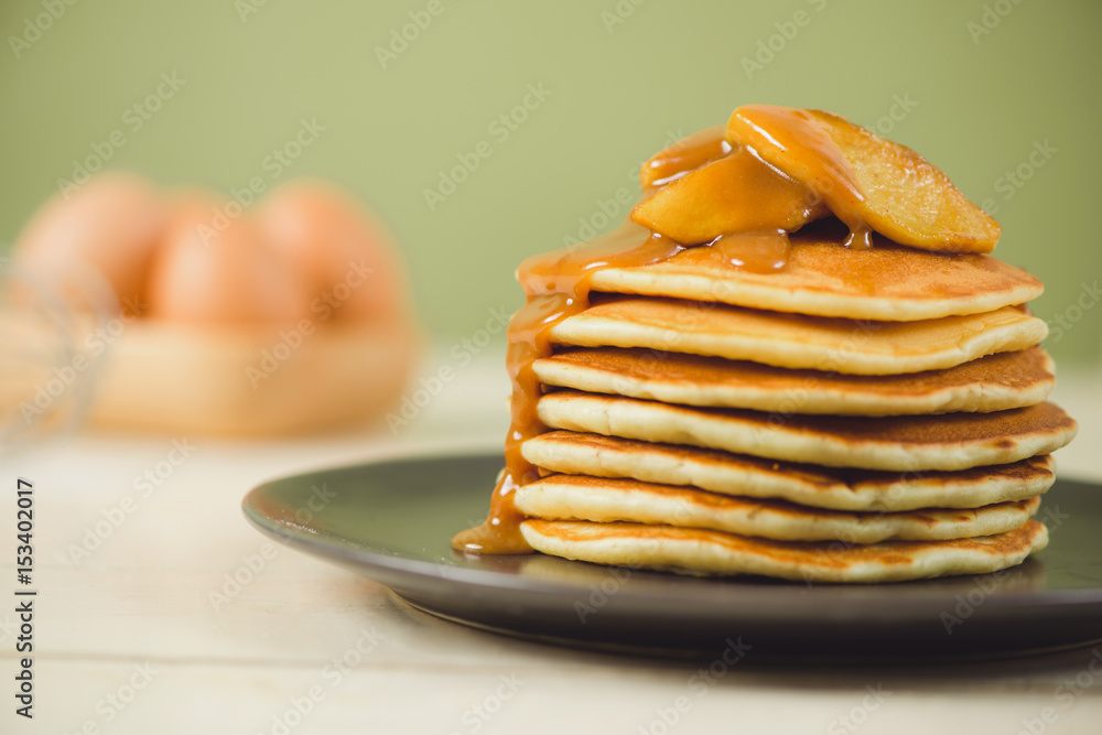 Pancakes with apple on table. Breakfast, snacks. Pancakes Day.