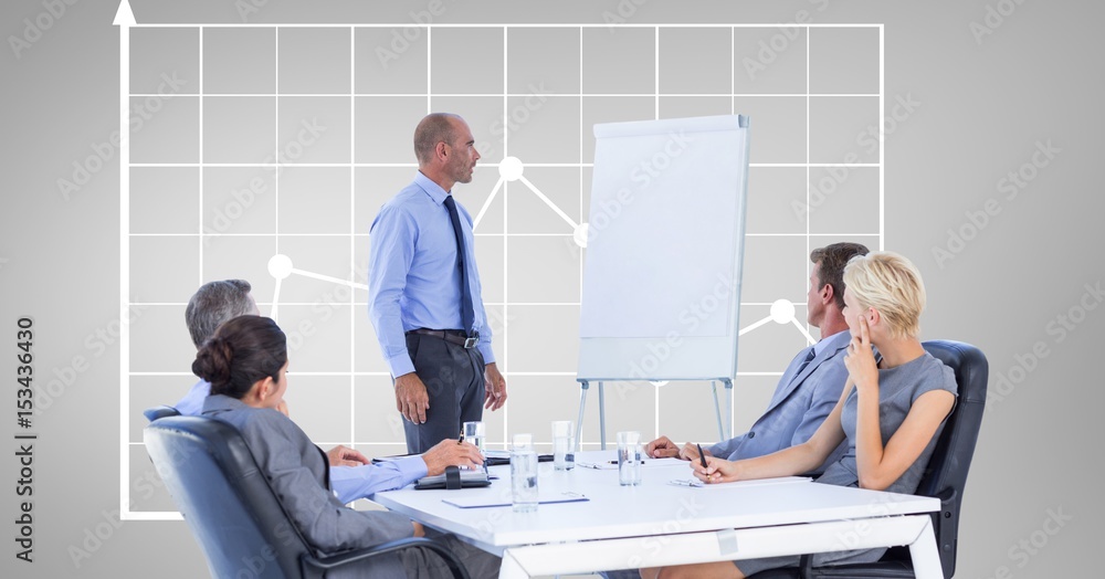 Businessman giving presentation to colleagues 