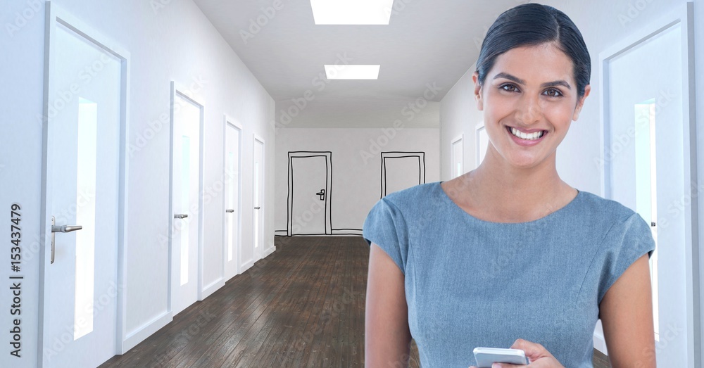 Businesswoman with mobile phone in office