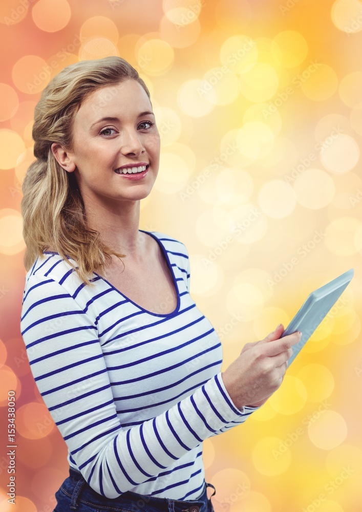 Smiling woman holding tablet PC 