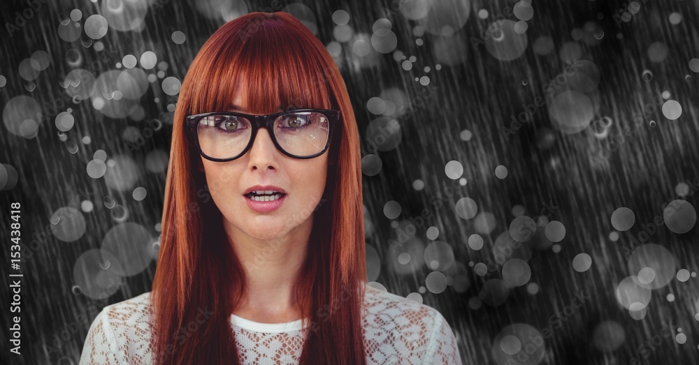 Surprised woman wearing eyeglasses on rainy day