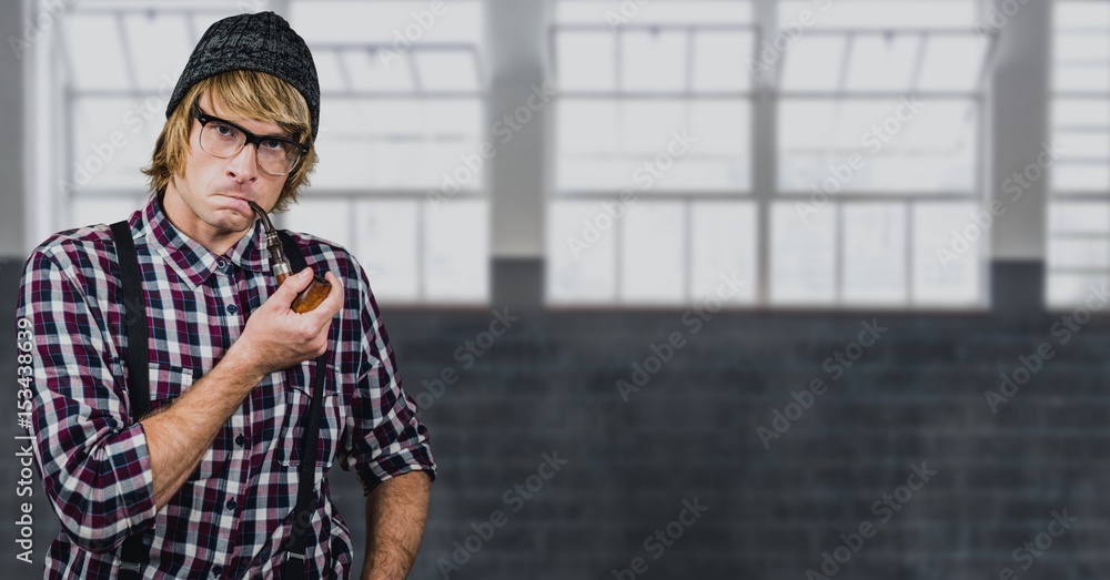 Confident hipster smoking pipe