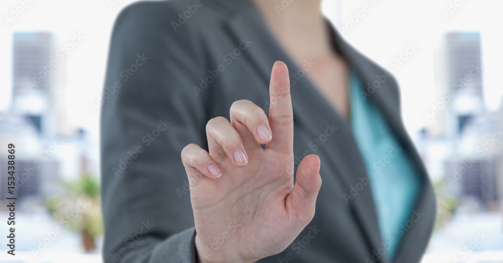 Midsection of businesswoman touching screen