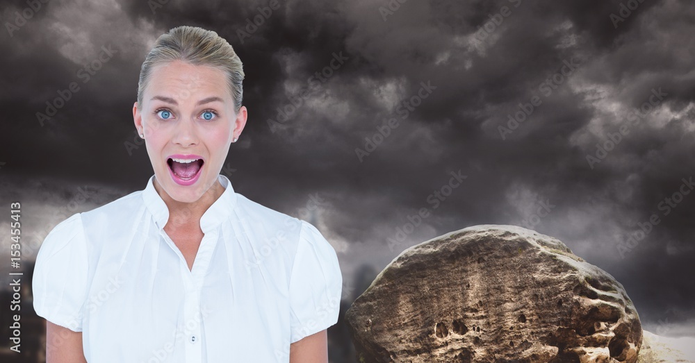 Young businesswoman screaming against cloudy sky