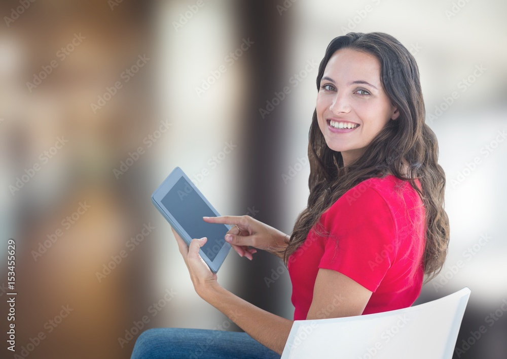 Portrait of woman smiling while using tablet PC