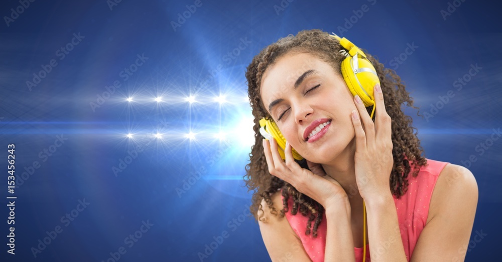 Female hipster listening to music on headphones