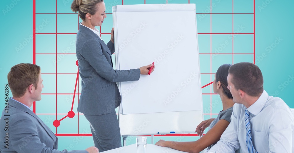 Woman giving presentation to colleagues against graph