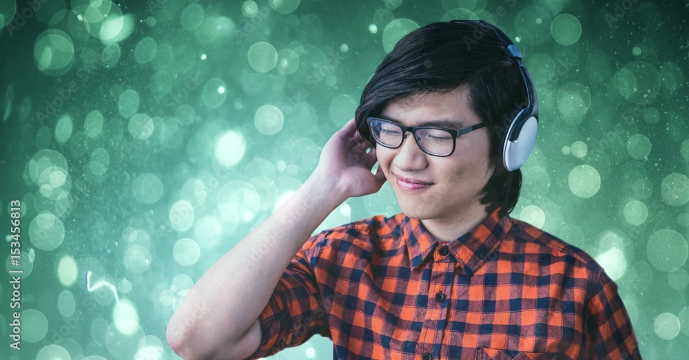 Smiling man enjoying music on headphones