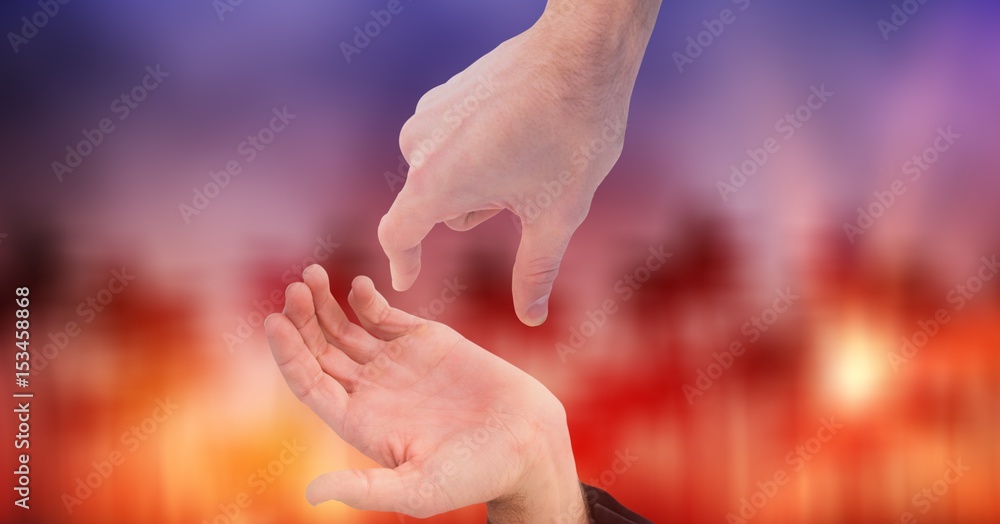 Cropped image of couples hands against bokeh