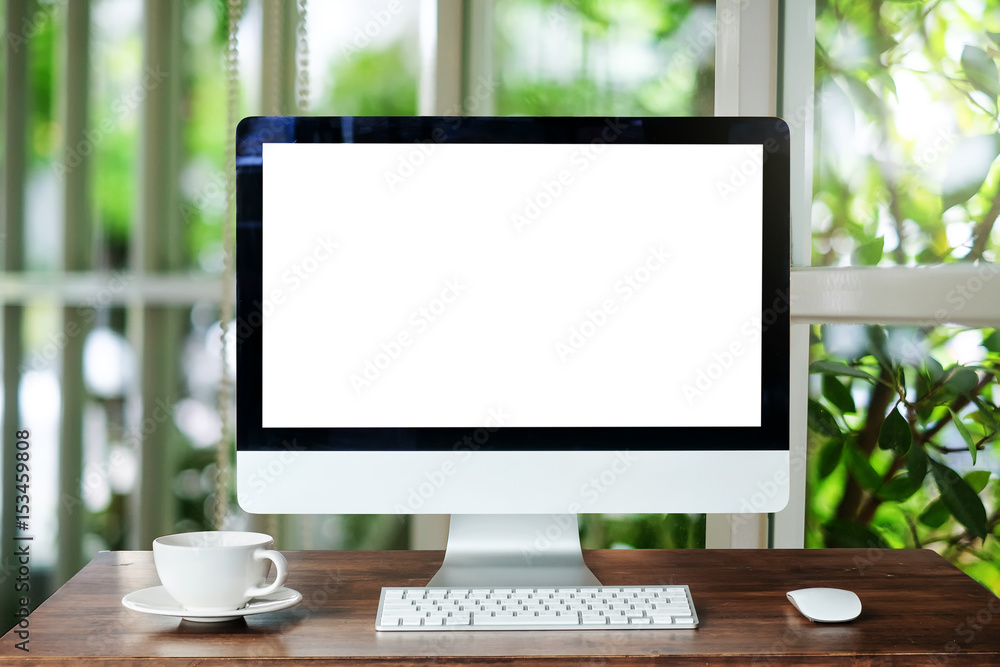 Computer Monitor, Keyboard,coffee cup and Mouse with Blank or White Screen Isolated is on the work t