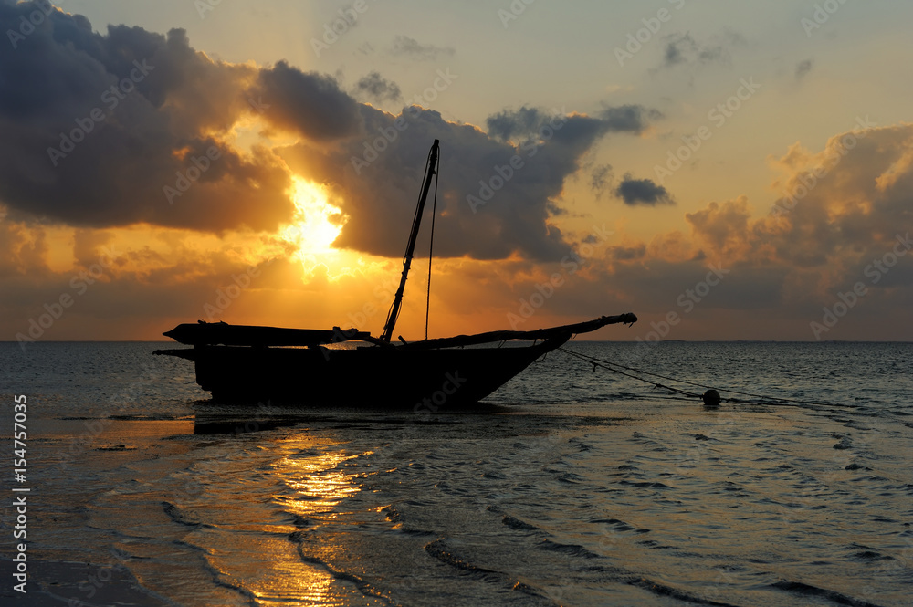 Beautiful tropical sunset with boat