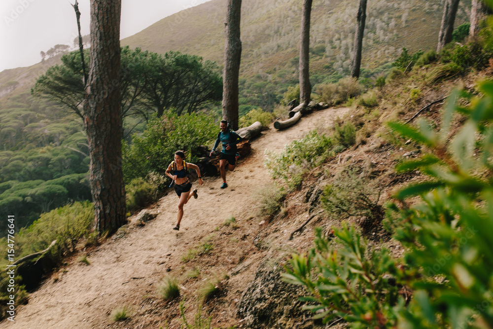 Young couple running in nature