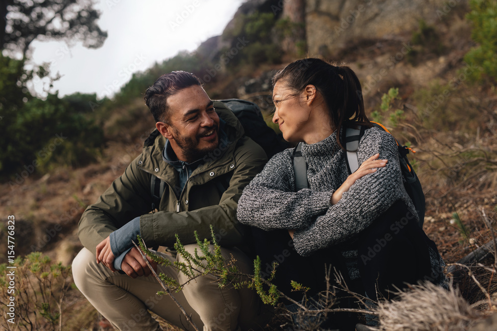 Young couple taking a break on a hike