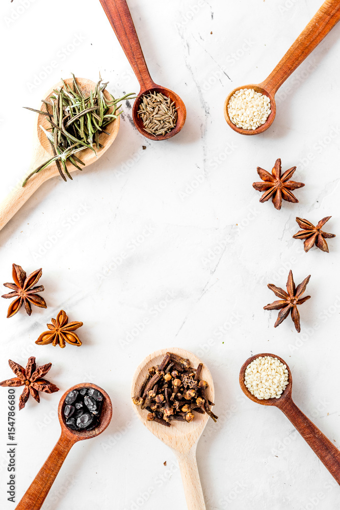 Spices, vanilla and herbs on white kitchen table background top view mock up