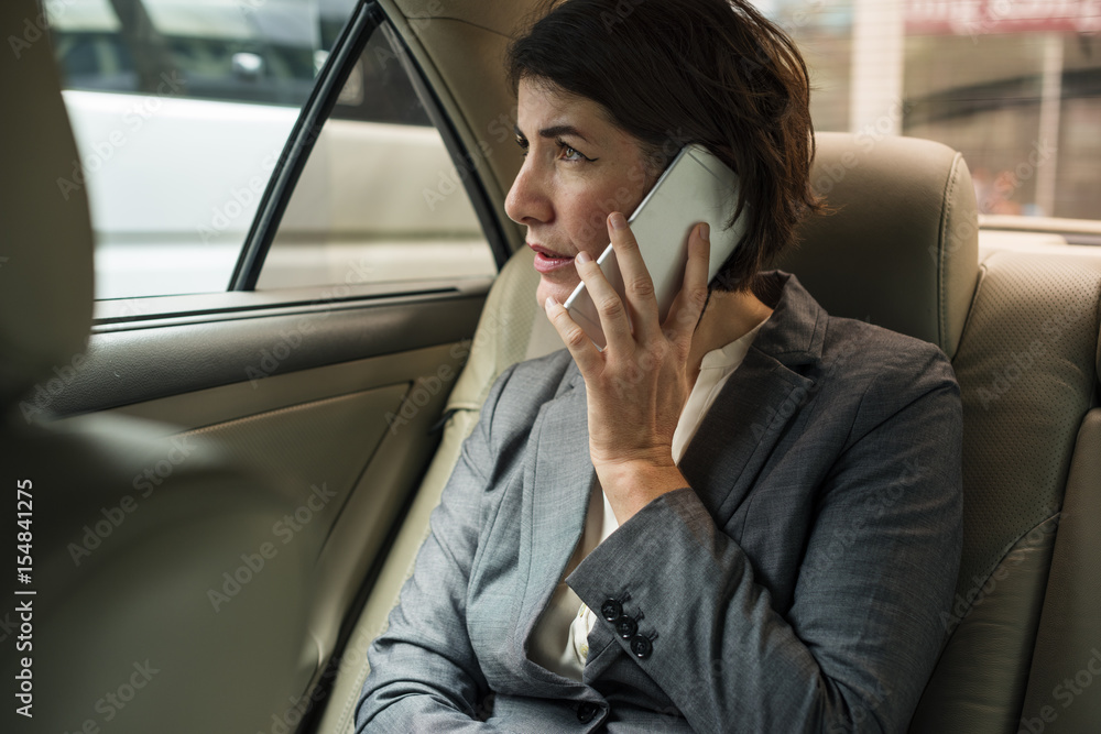 Businesswoman Talking Using Phone Car Inside