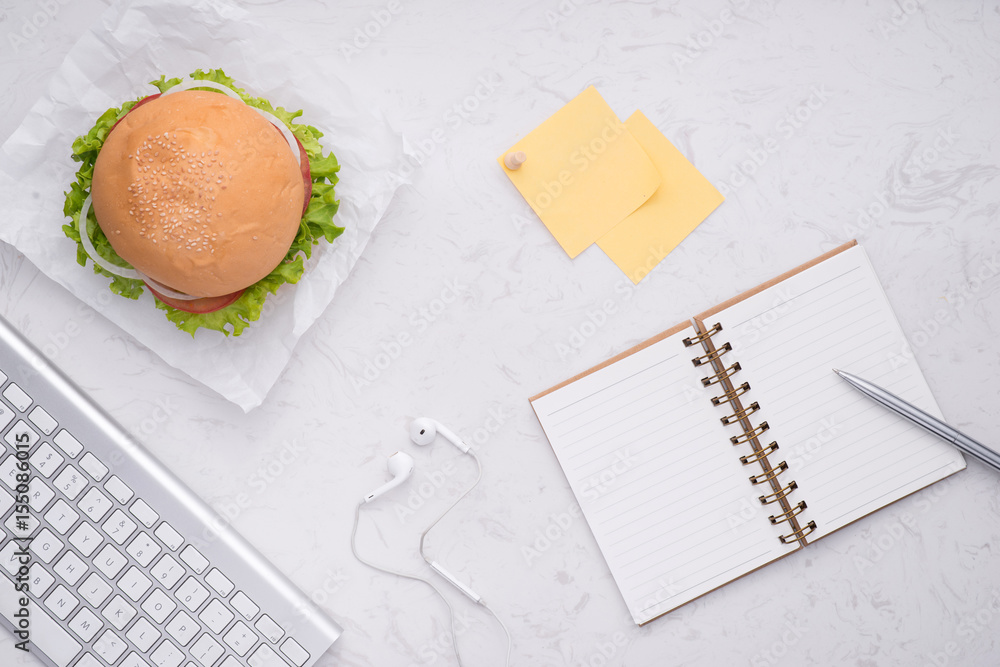 Lunch in office, delicious homemade burger on table.