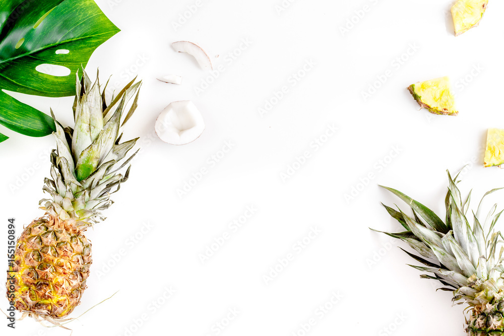 summer dessert with pineapples and leaves on white background top view mock up