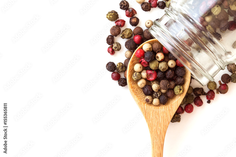 Close up mixed type of the peppercorns in wooden spoon , top view or overhead shot