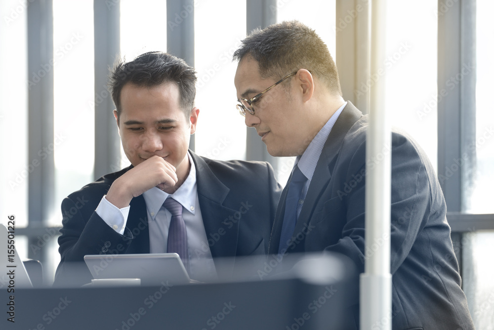 Business people discussing and working together during a meeting at outdoor cafe