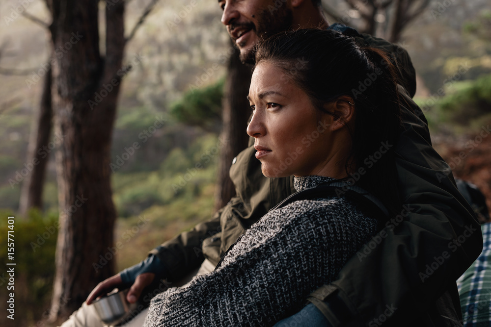 Young couple resting after hike