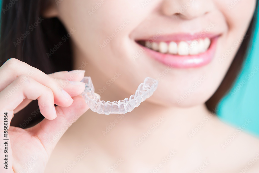 woman take invisible braces