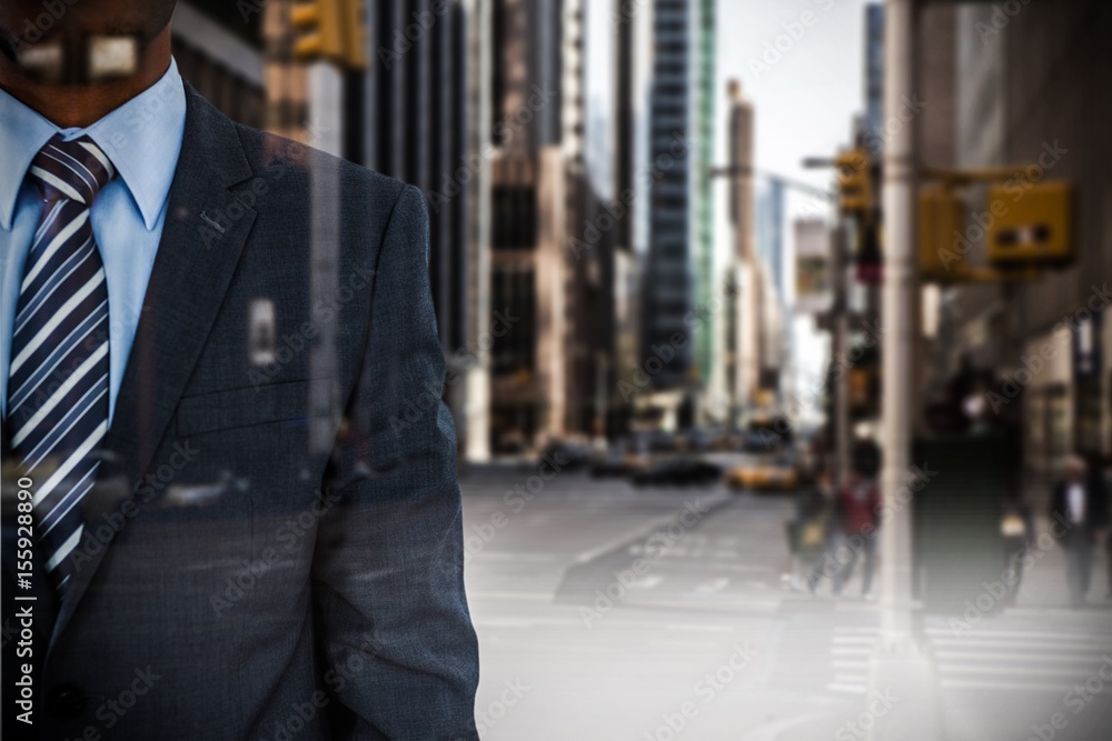 Composite image of businessman standing against white background