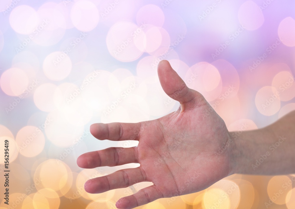 Hand open with sparkling light bokeh background