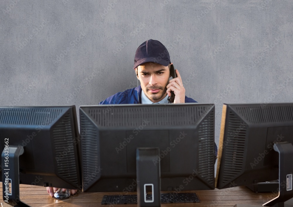 security guard behind the screens phoning