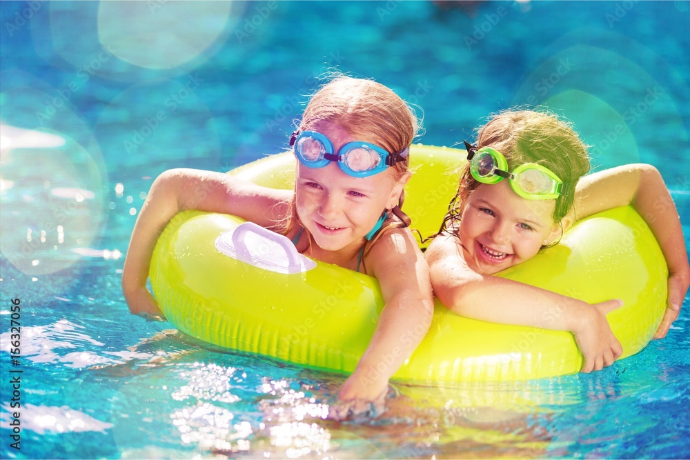 Kid in swimming pool.