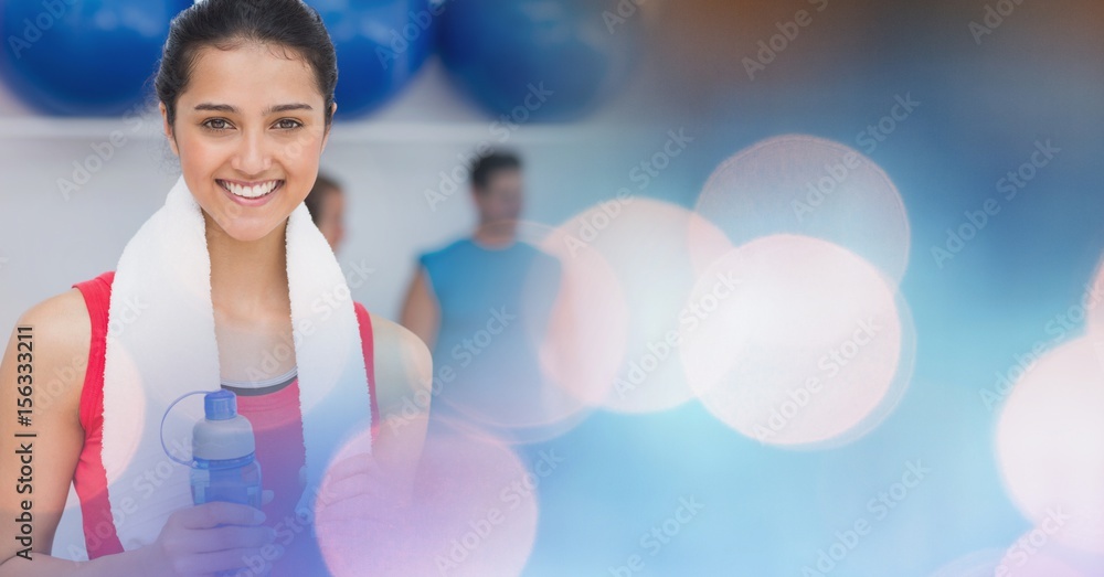 Woman with bottle and towel and blue pink bokeh transition