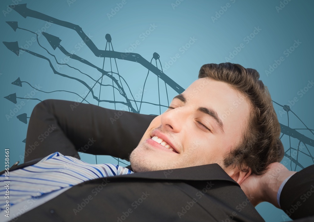 Business man lying back against graph doodle and blue background