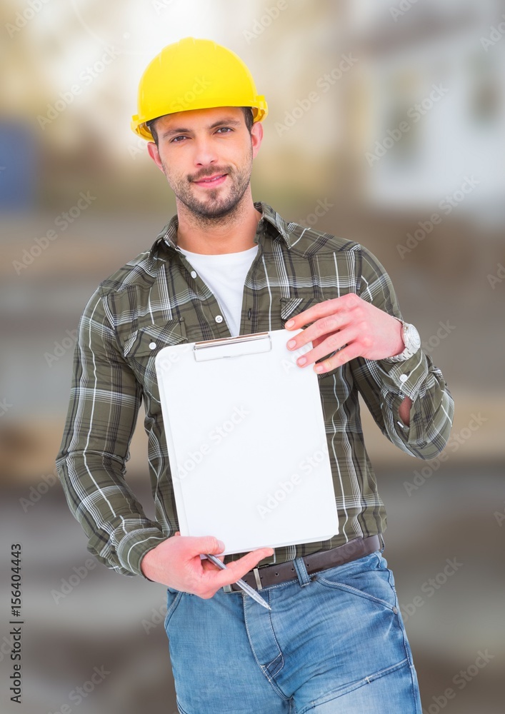 Construction Worker with chart in front of construction site