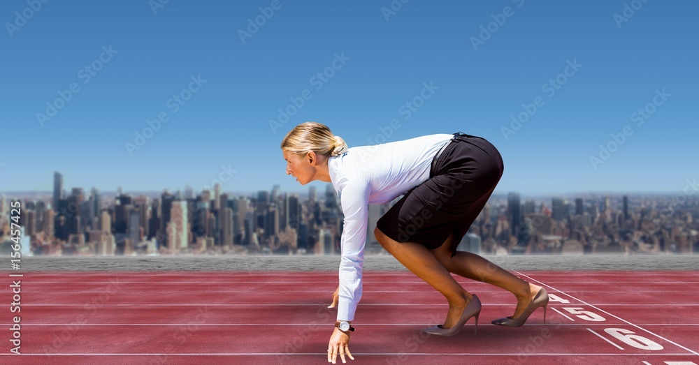 Digital image of businesswoman on starting line 