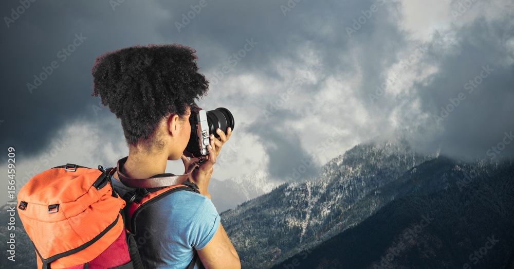 View of hipster taking pictures of mountains 