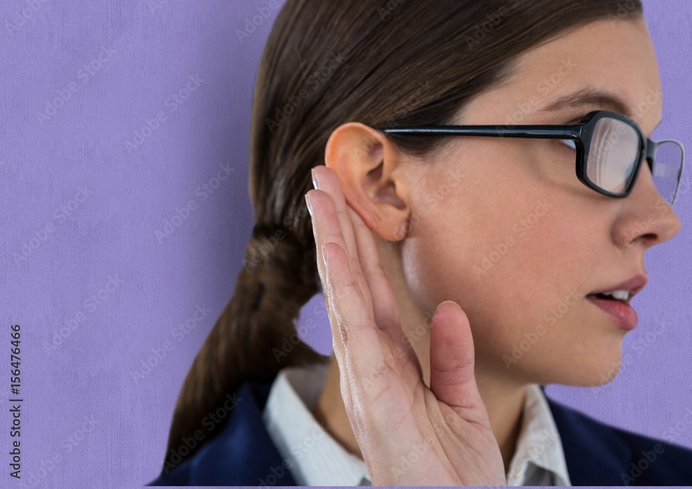 Businesswoman wearing eyeglasses listening